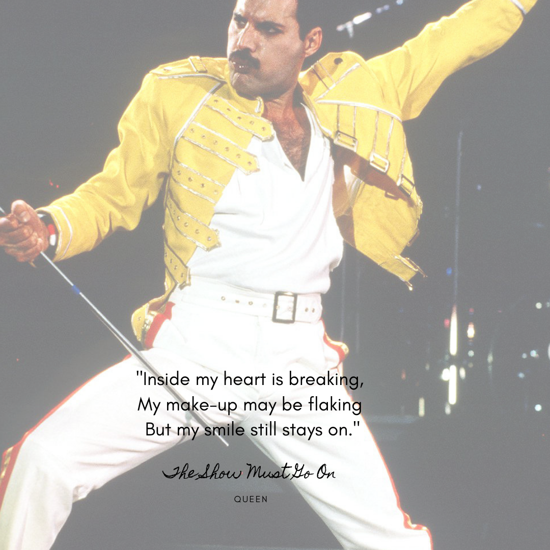 image of freddie mercury with lyrics from 'the show must go on' written underneath 