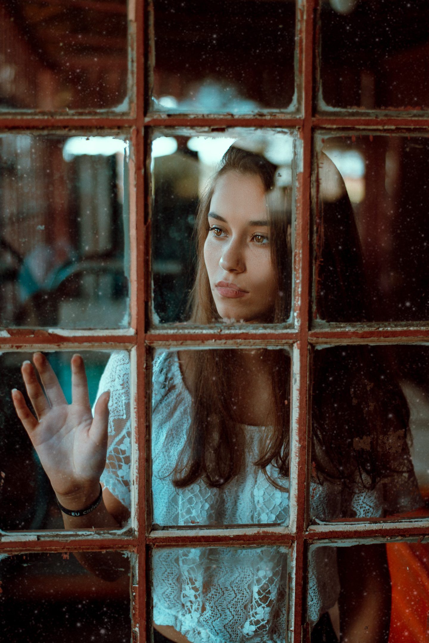 woman staring out of a window