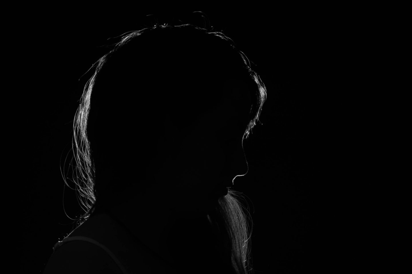 Silhouette of woman in dark